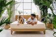 Couple lying on a Peace Lily brand latex mattress
