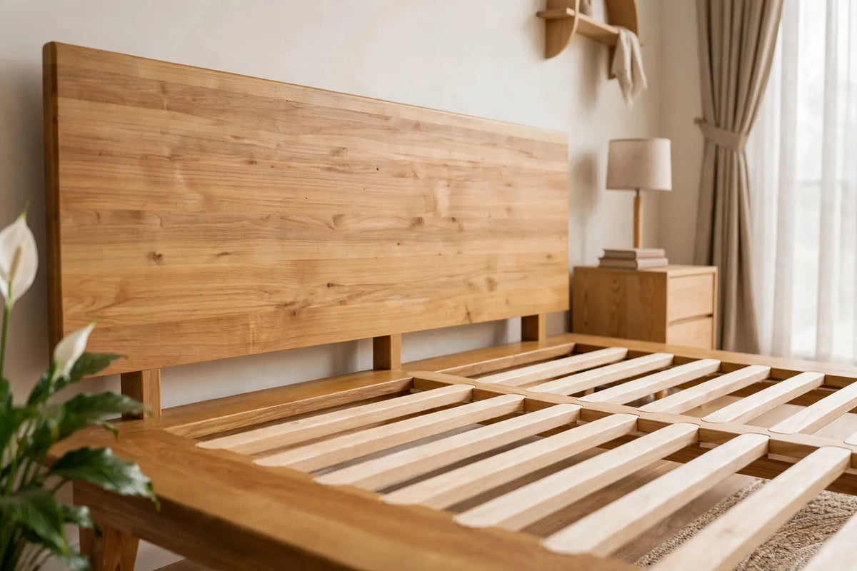 Angled view of the Peace Lily Timber Bed Frame's ash headboard and spaced timber slats